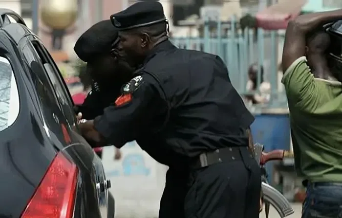 Who investigates police officers accused of collecting money from suspects?