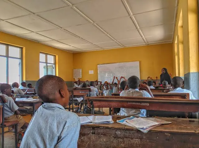 Why do some public schools collect charges despite promises of free education?