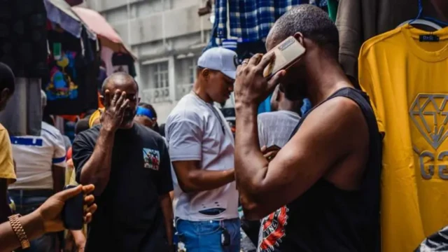 How do stolen mobile phones move from criminals into the Nigerian market?